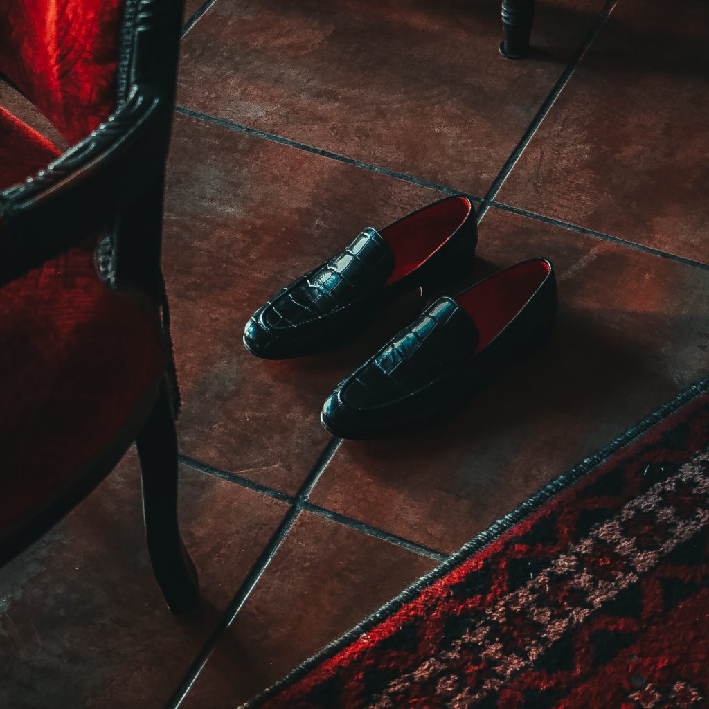 classic leather shoes in a traditional Iranian cafe
