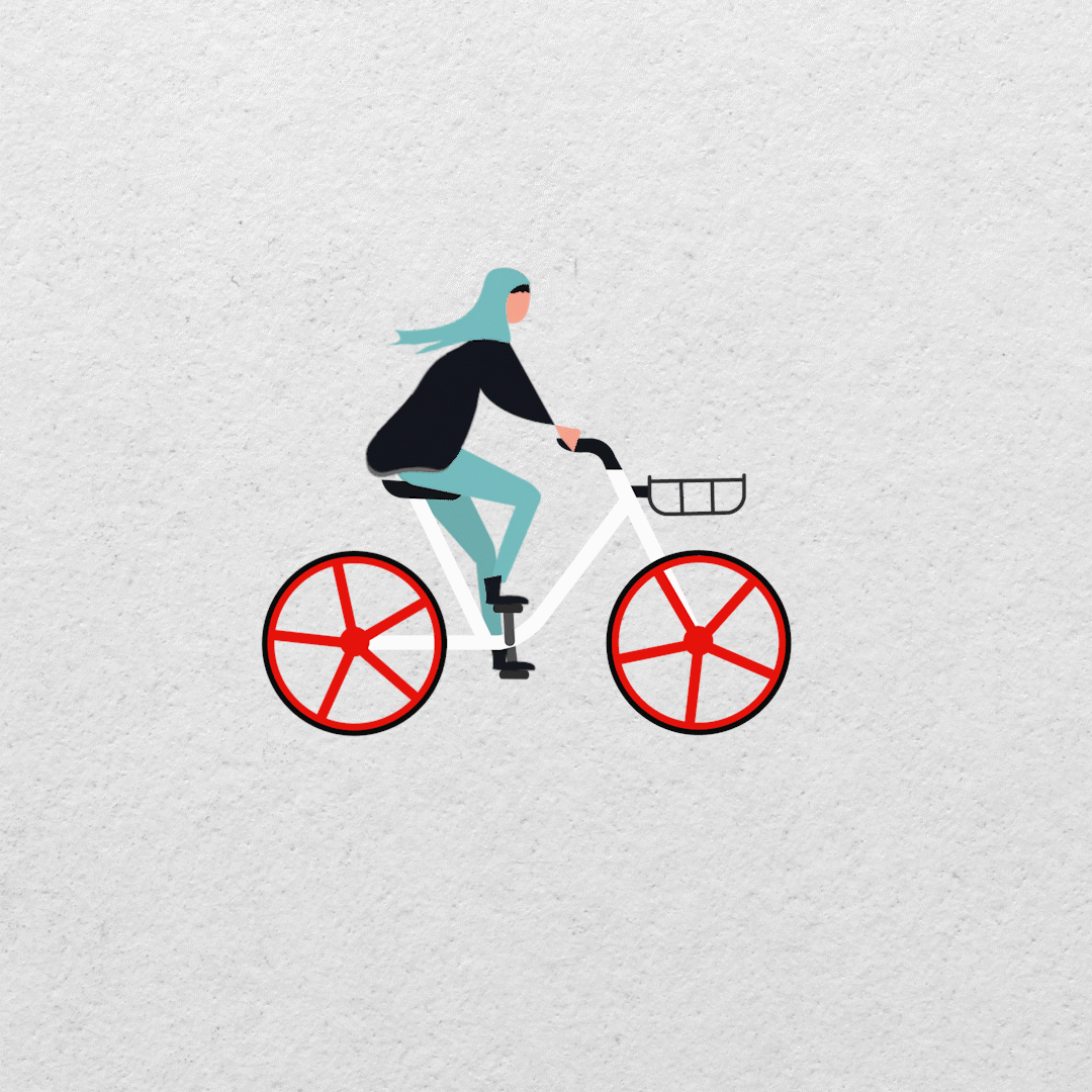 A muslim woman riding a bike